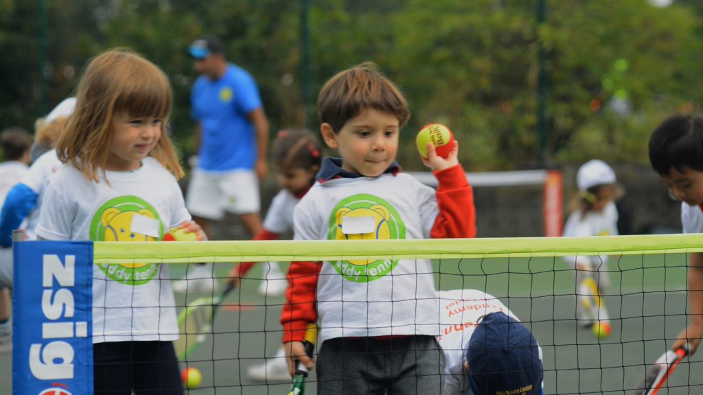 Child throwing ball Teddy Tennis United Kingdom